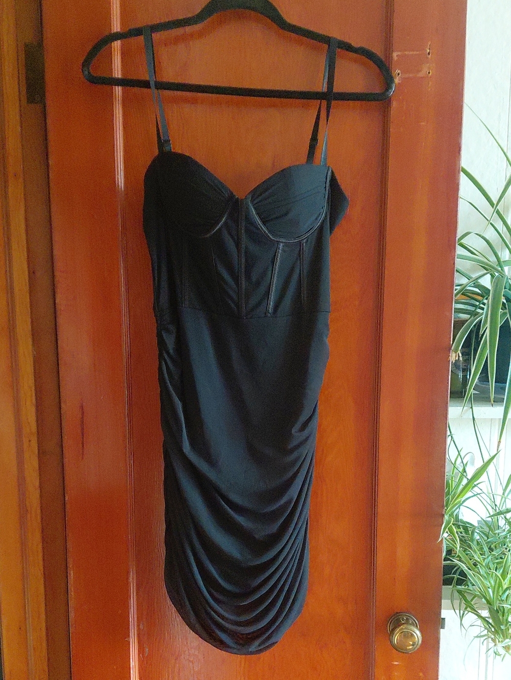 Sleek Black Bustier Mini Dress with Ruched Skirt